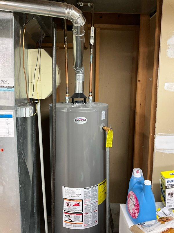 Completed comprehensive plumbing inspection of residential property, examining water heater installation in utility room and under-sink plumbing configuration in kitchen. All components, including Richmond water heater, supply lines, shut-off valves, P-trap assembly, and drainage system were inspected and found to be in proper working order with no leaks or deficiencies identified.
