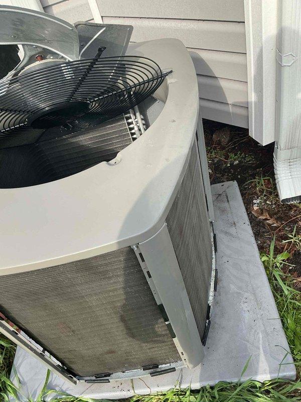 Completed comprehensive BFMA air conditioning tune-up on residential split system. Performed standard preventive maintenance protocol including inspection of indoor air handler and outdoor condensing unit. Replaced dirty pleated air filter at indoor unit to restore proper airflow and system efficiency. Accessed outdoor unit by removing side panel to inspect condenser coil, which showed moderate accumulation of dirt and debris on aluminum fins. Cleaned condenser coil to improve heat transfer efficiency and system performance. Verified fan operation and inspected all accessible components for wear or damage. System operational and ready for cooling season.