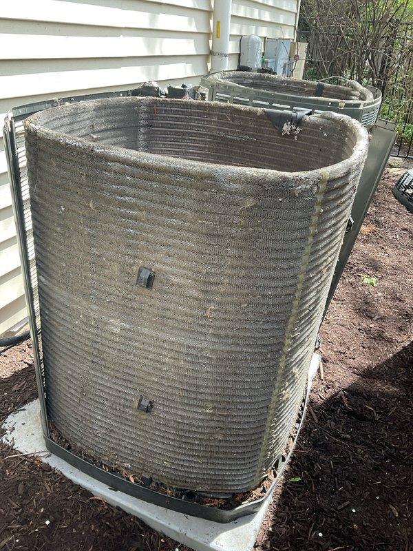 Completed comprehensive BFMA tune-up service on two outdoor AC condenser units, both over 9 years old. Performed thorough cleaning of heavily soiled condenser coils which exhibited significant dirt, dust, and debris accumulation in the metal fins. Inspected both units for proper operation, checked refrigerant levels, tested electrical connections, and replaced air filters. Both systems operating within normal parameters upon completion of preventive maintenance service.