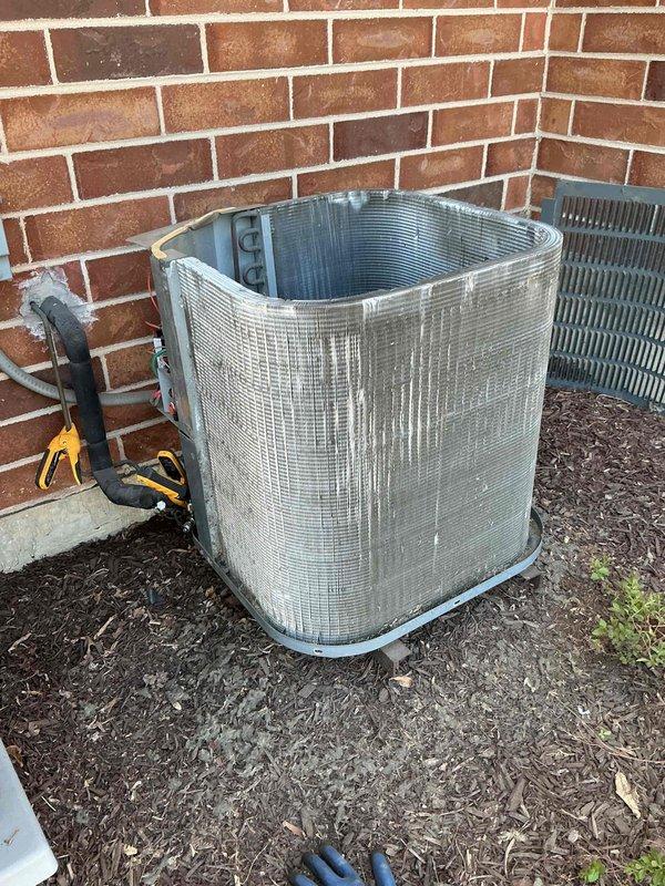 Completed comprehensive BFMA tune-up on 19-year-old commercial air conditioning system, including inspection of outdoor condenser unit and indoor evaporator coil assembly. Noted significant corrosion on copper refrigerant lines and heat exchanger components, along with mineral deposits and moisture damage on metal surfaces indicating long-term condensation exposure. Performed standard maintenance protocol, cleaned accessible components, and documented equipment condition with photographic evidence for service records.