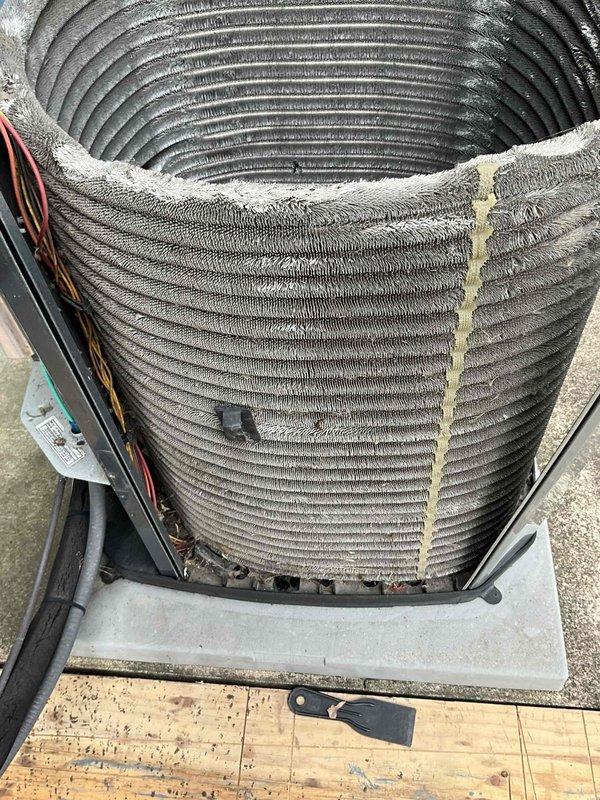 Completed comprehensive BFMA tune-up on 9+ year old air conditioning system. Performed standard maintenance protocol including inspection of condenser coil assembly, which showed significant accumulation of dust, dirt, and debris between fins and on outer surfaces. Evaluated electrical connections, capacitor, and overall unit operation to ensure proper system performance for the cooling season.