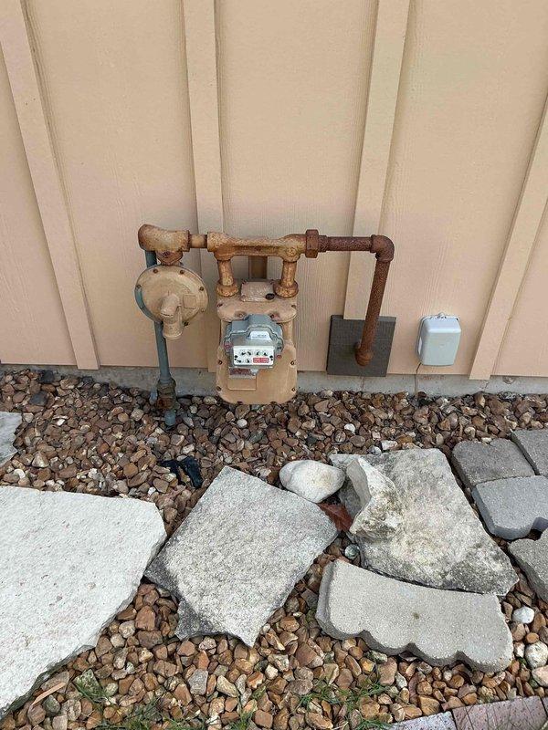 Completed comprehensive air conditioning tune-up on 8+ year old system during afternoon service window. Performed standard preventive maintenance protocol including inspection of all major components, refrigerant level verification, electrical connection testing, condensate drain evaluation, and filter assessment. Documented existing utility infrastructure and attic-mounted equipment installation with photographic records for maintenance history.