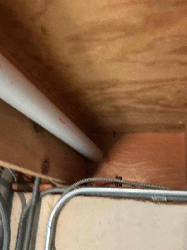 Completed comprehensive air conditioning tune-up on 8+ year old system during afternoon service window. Performed standard preventive maintenance protocol including inspection of all major components, refrigerant level verification, electrical connection testing, condensate drain evaluation, and filter assessment. Documented existing utility infrastructure and attic-mounted equipment installation with photographic records for maintenance history.