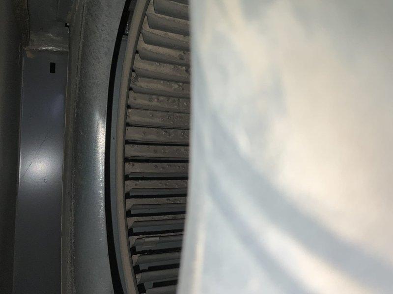 Completed comprehensive AC tune-up maintenance on two air conditioning systems at residential property. Performed standard preventive maintenance procedures including inspection of blower assembly, which showed moderate dust accumulation on squirrel cage fan blades. Accessed equipment in basement mechanical room where air handler and ductwork are located alongside water heater and associated plumbing systems. Inspected flexible duct connections, sheet metal ductwork, and overall system components. Coordinated arrival time with occupant requiring 30-minute advance notice. Documented equipment age for service records as it was previously unknown. Captured photographic documentation of mechanical room layout, HVAC equipment configuration, and blower wheel condition for maintenance files. All systems operational upon completion of tune-up procedures.