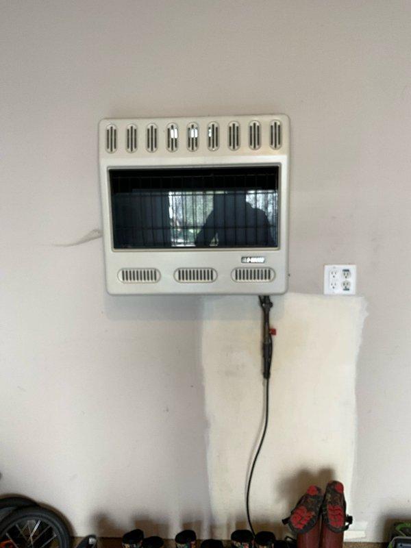 Responded to client request to remove and cap off an unused wall-mounted ventless gas heater located in garage. Successfully disconnected gas supply line, removed heater unit from wall mounting bracket, and properly capped gas line at connection point per code requirements. Verified no gas leaks at cap using leak detection solution and confirmed safe shutdown of system.