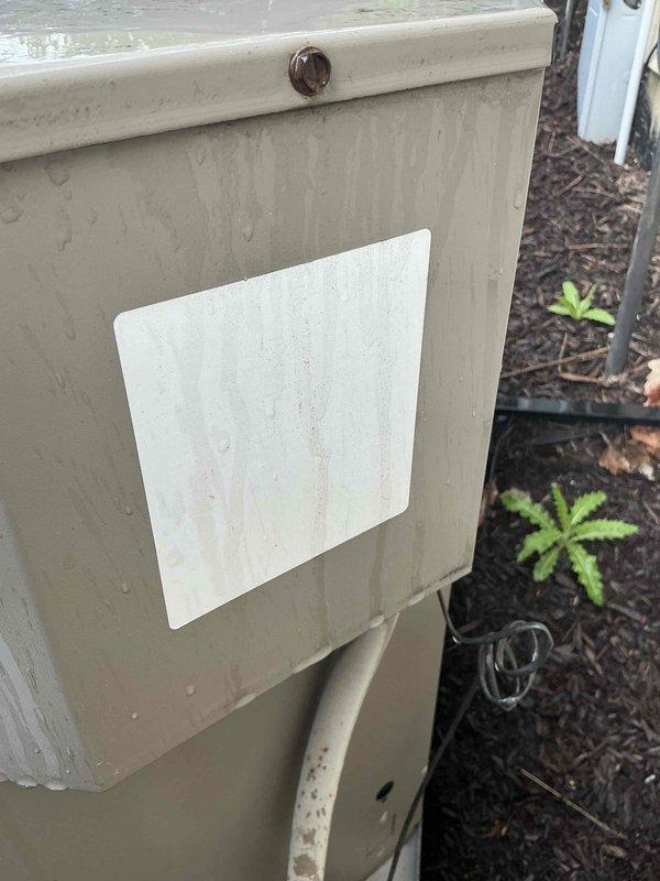 Performed comprehensive evaluation of failed upstairs outdoor AC compressor unit and indoor evaporator coil system. Documented existing equipment conditions including weathered outdoor condensing unit with visible corrosion on electrical disconnect panel and complete HVAC system configuration in mechanical room showing furnace, ductwork, refrigerant lines, and associated components. Provided detailed replacement estimate for new matched air conditioning system including outdoor condensing unit and indoor evaporator coil to restore cooling capacity to upper level of residence.