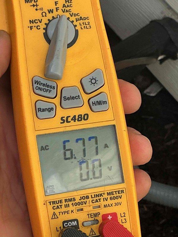 Completed BFMA tune-up on residential HVAC system. Performed electrical diagnostics using digital multimeter, verified voltage readings at 6.77 AC volts to ensure proper system operation. Inspected basement utility area including water heater, PVC plumbing connections, and associated mechanical systems to confirm no interference with HVAC equipment operation.