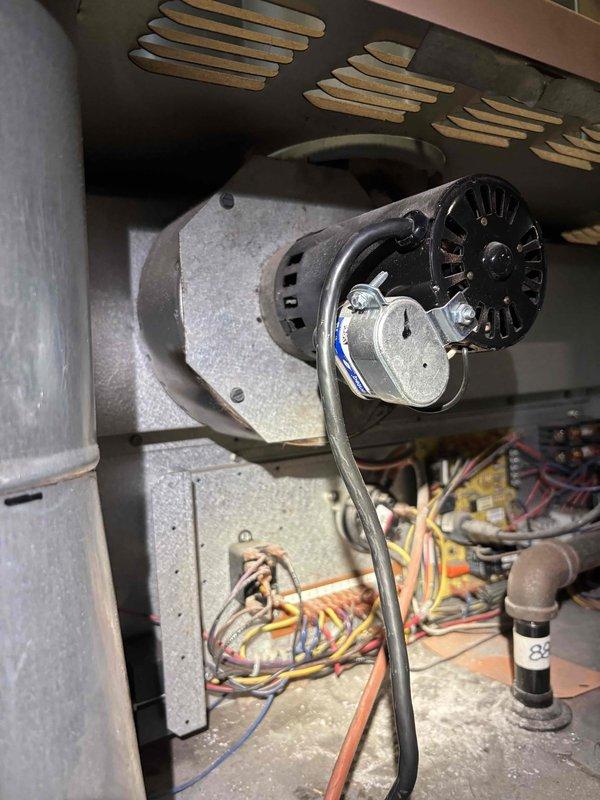 Performed preventive maintenance tune-up on commercial rooftop units located in warehouse area approximately 10 feet above ground level, requiring 8-foot ladder for access. Completed inspection and service of 2-3 RTUs as initial phase of comprehensive maintenance program, focusing on blower motor assemblies, electrical connections, and capacitor systems. Documented total equipment count of 20 RTUs on-site for future scheduled maintenance planning.