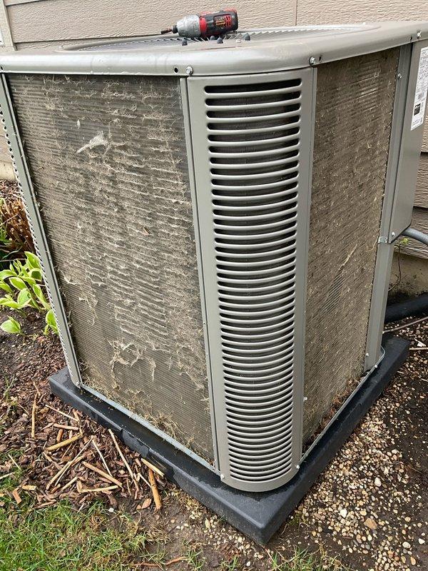 Completed comprehensive BFMA tune-up on residential air conditioning system over 3 years old. Upon arrival, found outdoor condenser unit heavily coated with dirt, dust, pollen, and environmental debris on both exterior panels and louver vents, significantly restricting airflow. Performed thorough cleaning of condenser coils and exterior surfaces, removed debris accumulation, inspected electrical connections, verified refrigerant levels, tested system operation, and confirmed proper airflow restoration for optimal cooling efficiency.