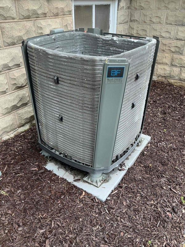 Completed comprehensive BFMA preventative maintenance tune-up on two commercial Blue Frost air conditioning units, approximately three years old. Performed full system inspection including electrical component testing with clamp meter showing 14.9 amp draw, verified capacitor operation, inspected condenser coils and fan assemblies, checked refrigerant levels, and confirmed proper unit operation. Both systems operating within normal parameters with no deficiencies noted.