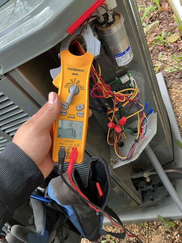 Completed comprehensive BFMA preventative maintenance tune-up on two commercial Blue Frost air conditioning units, approximately three years old. Performed full system inspection including electrical component testing with clamp meter showing 14.9 amp draw, verified capacitor operation, inspected condenser coils and fan assemblies, checked refrigerant levels, and confirmed proper unit operation. Both systems operating within normal parameters with no deficiencies noted.