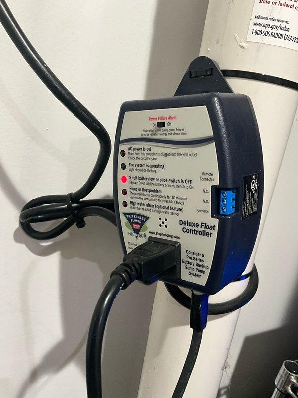 Completed pre-sale plumbing site visit to verify all systems operational. Inspected sump pump system including basin, discharge piping, and backup power failure alarm controller. Confirmed pump assembly properly installed with dual discharge lines, secure electrical connections, and functional float controller. Verified Deluxe Float Controller mounted and displaying operational status with backup battery system in place. All components found in working order with no immediate concerns identified.