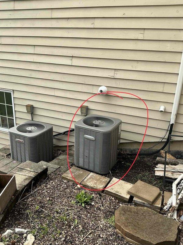 Provided estimate for replacement of second-floor air conditioning system in a two-zone residential HVAC setup with dual furnaces and AC units. Inspected existing equipment including air handler unit mounted in interior mechanical closet with associated ductwork and PVC condensate piping, as well as outdoor condenser units positioned on concrete pads against exterior wall with refrigerant lines running to interior components.
