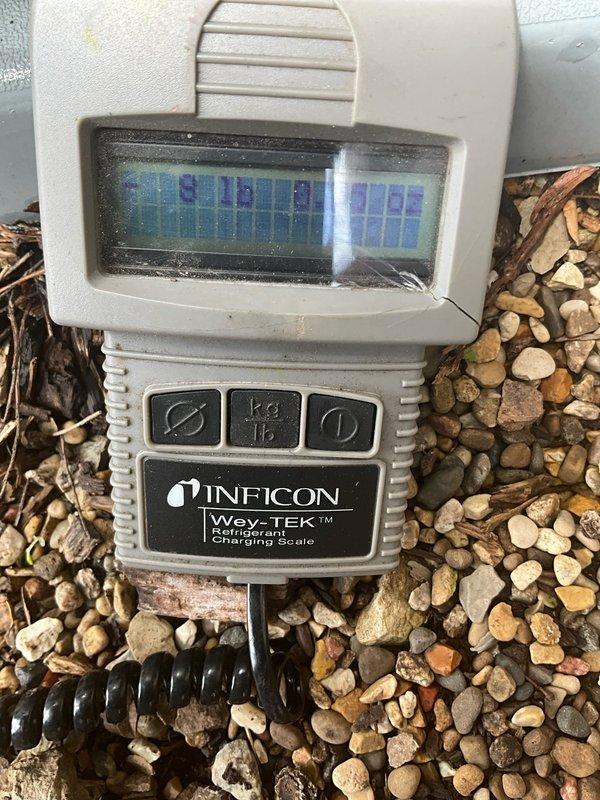 Responded to no cooling call on residential Bryant air conditioning system. Upon arrival, found unit not operating. Performed diagnostic evaluation and determined system required refrigerant charge. Used Inficon Wey-TEK refrigerant charging scale to accurately measure and add proper refrigerant charge to system. Verified unit operation and proper cooling function restored before departure.