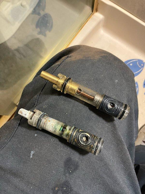 Responded to bathroom plumbing issue and successfully replaced corroded shower valve stem that was causing operational problems. The old valve stem showed significant oxidation and green patina buildup, which was replaced with a new brass component to restore proper water control functionality in the shower system.