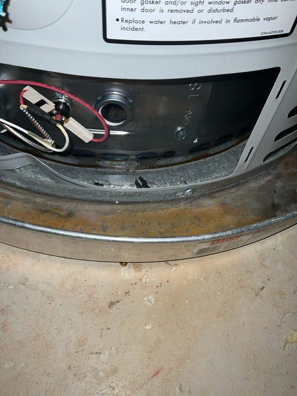 Responded to service call for recently installed tanked water heater experiencing leaking and complete loss of hot water. Upon arrival, performed comprehensive inspection of unit installed in September. Identified active leak at base of water heater with visible water accumulation in drip pan showing rust and corrosion. Inspected all plumbing connections including copper supply lines and fittings at top of unit, examining for loose connections or failed seals. Evaluated gas control valve, burner assembly, and electrical connections at base of tank. Assessed temperature and pressure relief valve for proper operation and signs of discharge. Documented condition of installation including insulation wrap, securing tape, and overall system configuration. Photographed leak source, drip pan condition, and mechanical components for warranty evaluation. Determined unit failure likely due to internal tank defect given recent installation date. Provided customer with findings and recommendations 