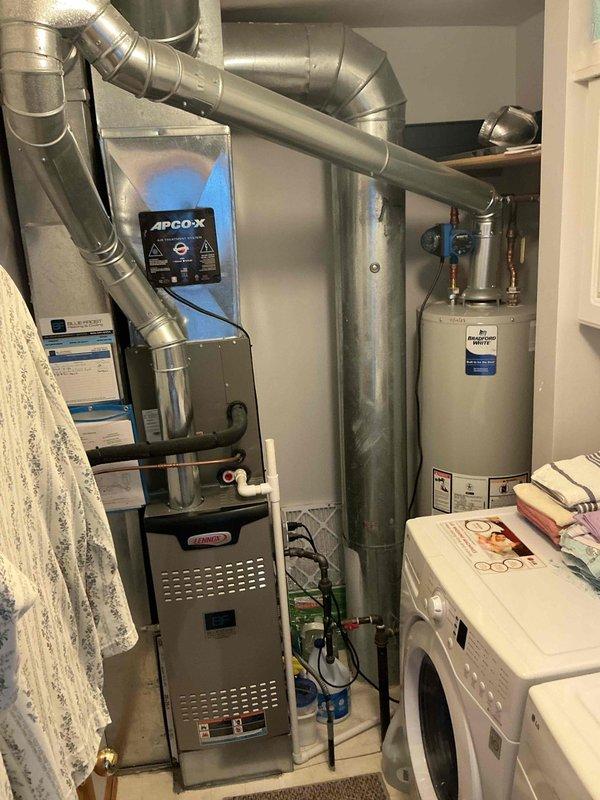 Completed comprehensive BFMA air conditioning tune-up service during afternoon hours. Performed full system inspection of HVAC equipment, including furnace unit with APCO-X air purification system, ductwork connections, and associated utility components. All equipment found to be operating within normal parameters, with proper airflow through ventilation grilles and secure ductwork connections throughout the installation.