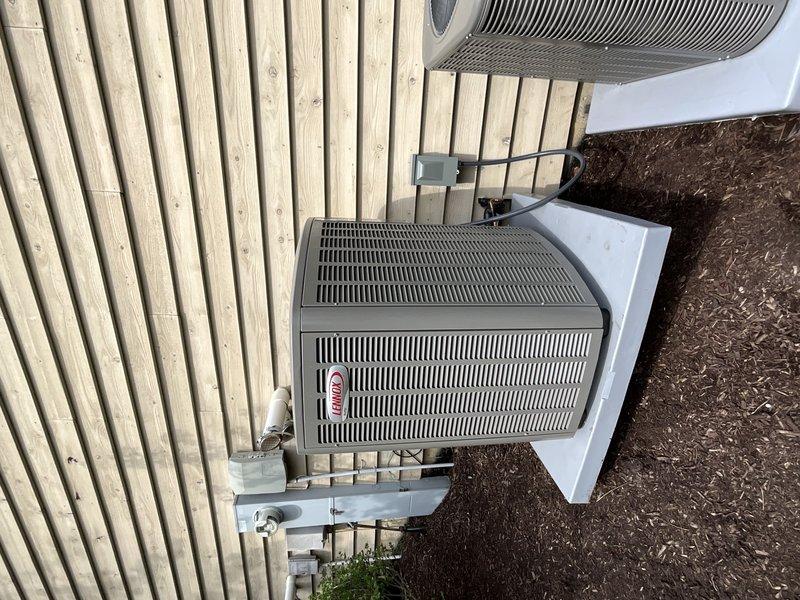 Completed installation of Lennox EL16KC1-036 air conditioning unit with matching CK40CT-36B evaporator coil, Ecobee smart thermostat, and whole-home humidifier. Unit was properly positioned on concrete pad with appropriate clearances, electrical disconnect installed, and all refrigerant lines connected and tested. Additionally inspected previously installed system per customer concern regarding condenser operation during heating mode in winter months; verified system wiring and control sequences to address off-season compressor activation issue.