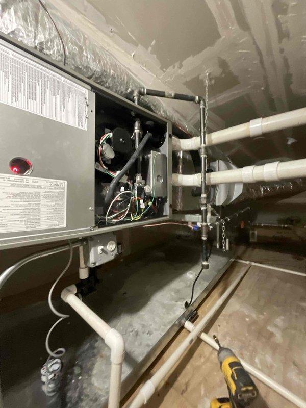 Completed furnace replacement in attic with installation of Lennox EL297UH045XV36BK horizontal configuration unit. Reinstalled existing thermostat and reused existing PVC exhaust and intake venting system, ensuring proper connections and secure mounting in accordance with manufacturer specifications.