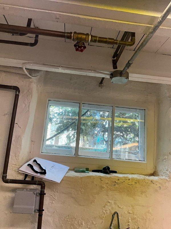 Responded to service call for leaking outdoor spigot. Upon arrival, located and inspected the exterior hose bib supply line and shutoff valve in the interior utility room. The outdoor spigot was supplied by overhead piping running along the ceiling with a red-handled shutoff valve controlling flow to the exterior fixture. Identified source of leak and completed necessary repairs to restore proper function and eliminate water loss. Tested system operation to confirm leak was resolved and shutoff valve operates correctly for seasonal winterization.