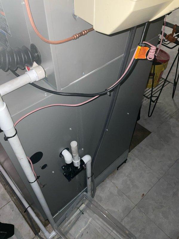 Responded to service call for water leak in basement originating from HVAC system installed earlier this year. Upon inspection, identified active leak at water supply line connection to furnace-mounted humidifier. Repaired leaking water line connection to humidifier, verified proper seal, and tested system operation to confirm leak resolution. No further issues observed at time of service completion.