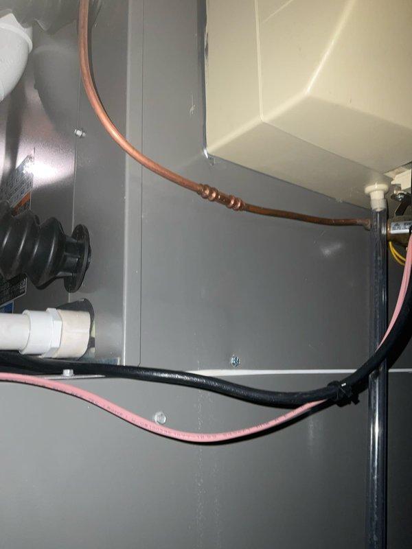 Responded to service call for water leak in basement originating from HVAC system installed earlier this year. Upon inspection, identified active leak at water supply line connection to furnace-mounted humidifier. Repaired leaking water line connection to humidifier, verified proper seal, and tested system operation to confirm leak resolution. No further issues observed at time of service completion.