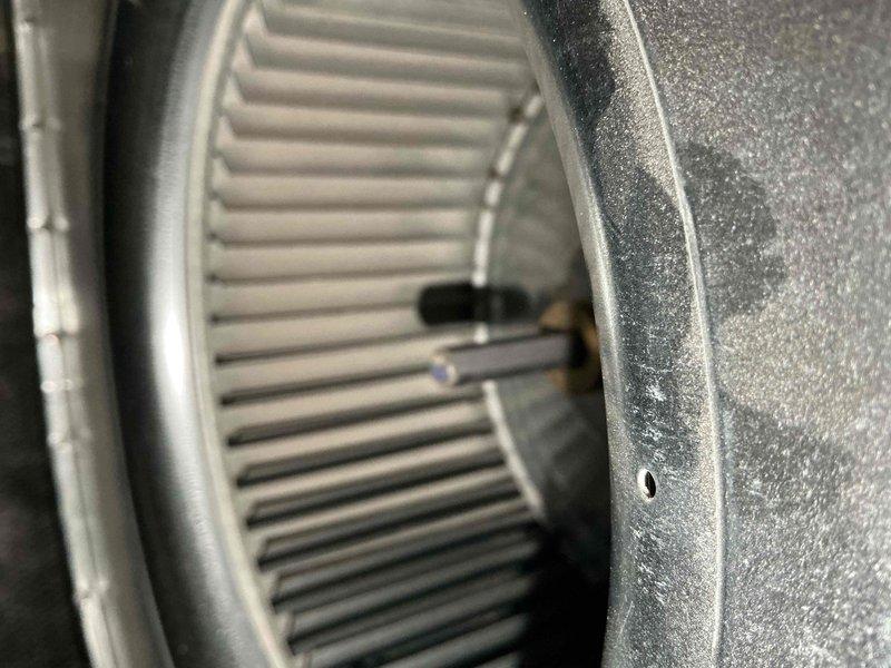 Completed comprehensive BFMA tune-up on 5+ year old air conditioning system during afternoon service window. Performed full system inspection including blower wheel assembly examination, verified proper operation of electrical components and capacitor (marked 3+75 MFD), checked all wire connections and terminals for security, and assessed overall unit condition. System components showed normal operational wear with blower wheel in clean condition; documented equipment status with detailed photographs for service records.