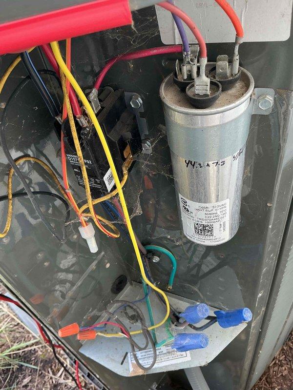 Completed comprehensive BFMA tune-up on 5+ year old air conditioning system during afternoon service window. Performed full system inspection including blower wheel assembly examination, verified proper operation of electrical components and capacitor (marked 3+75 MFD), checked all wire connections and terminals for security, and assessed overall unit condition. System components showed normal operational wear with blower wheel in clean condition; documented equipment status with detailed photographs for service records.