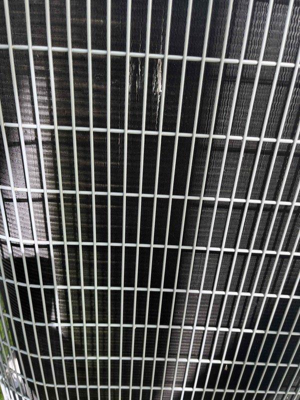 Completed comprehensive BFMA tune-up on outdoor air conditioning unit per recurring maintenance agreement. Performed full system inspection including condenser coil examination, verified protective grille integrity, and documented unit condition with photographic evidence. Unit found in good operational condition with clean condenser fins and properly functioning components; all maintenance procedures completed successfully within scheduled timeframe.