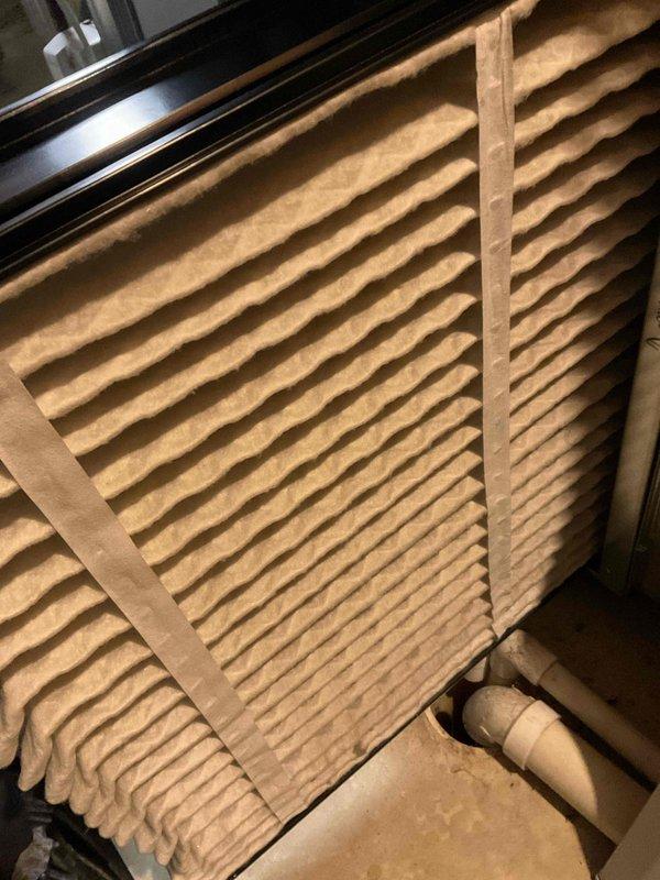 Completed comprehensive BFMA tune-up on residential air conditioning system over 2 years old, including full system inspection, air filter evaluation, and electrical component assessment. Inspected outdoor condensing unit electrical panel, noting capacitor with corrosion on mounting bracket and verifying all wire connections, contactors, and relay components; evaluated indoor air handler and pleated air filter condition. Customer requested estimate for installation of inline duct booster fan to improve heat distribution to unheated basement area.