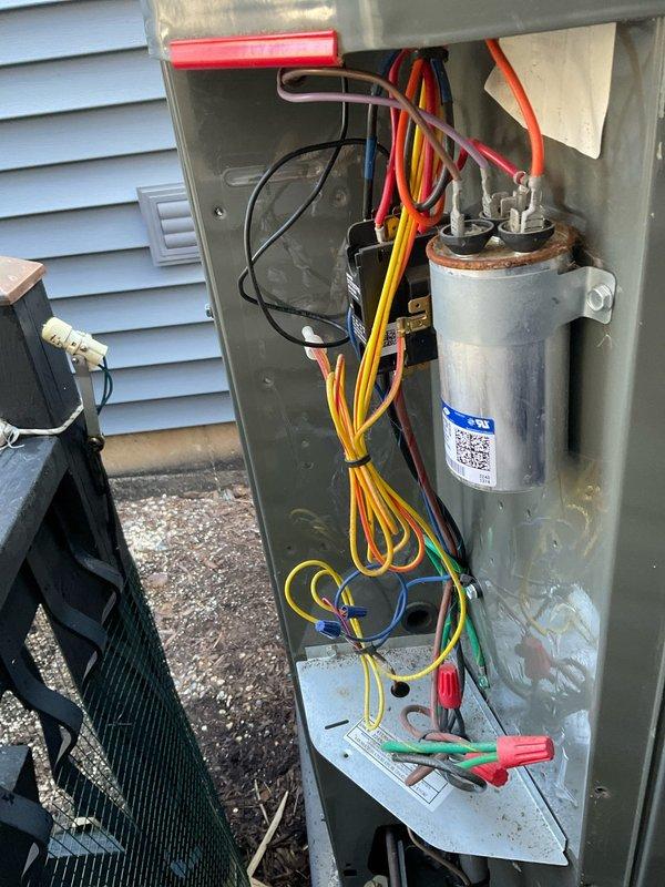 Completed comprehensive BFMA tune-up on residential air conditioning system over 2 years old, including full system inspection, air filter evaluation, and electrical component assessment. Inspected outdoor condensing unit electrical panel, noting capacitor with corrosion on mounting bracket and verifying all wire connections, contactors, and relay components; evaluated indoor air handler and pleated air filter condition. Customer requested estimate for installation of inline duct booster fan to improve heat distribution to unheated basement area.