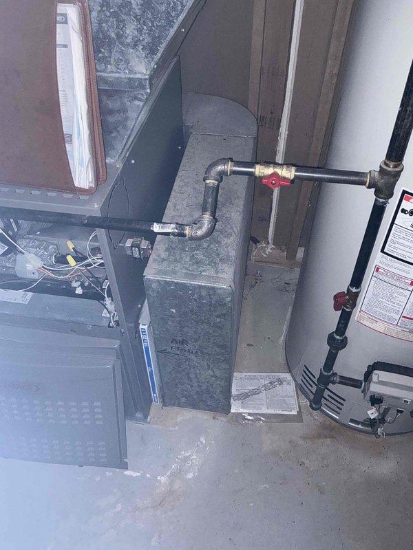 Conducted on-site assessment of existing HVAC system to provide furnace replacement estimate. Client previously received quote for draft inducer motor replacement and requested evaluation to determine if full system replacement would be more cost-effective solution. Inspected air handler unit, furnace, and associated ductwork and piping connections. Documented current equipment configuration including insulated refrigerant lines, electrical connections, and overall system condition. Noted deteriorated electrical panel with significant rust and corrosion present in mechanical room area. Photographed existing installation for estimate preparation. Provided technical recommendations comparing repair versus replacement options based on equipment age, condition, and long-term reliability considerations.