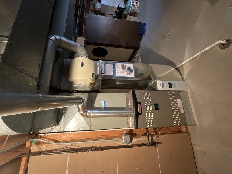 Completed installation of Lennox SL280V110UHV60 variable-speed gas furnace with AA1210 evaporator coil and P200 media air cleaner in mechanical room. All ductwork connections were properly secured with insulated flexible ducts, unit was tested for proper operation, and system was commissioned to manufacturer specifications. Installation included setup of service financing for the equipment upgrade.