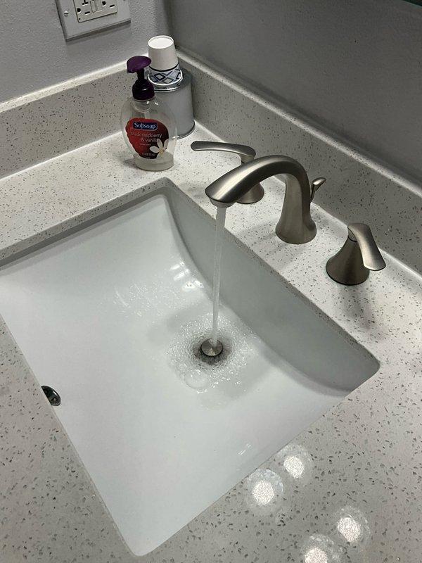 Completed comprehensive plumbing inspection and tune-up maintenance service at residential property. Inspected bathroom fixtures including undermount sink with brushed nickel faucet assembly, verified proper water flow and drainage operation, and examined toilet installation and functionality. All plumbing fixtures found to be operating within normal parameters with no leaks or immediate concerns identified.