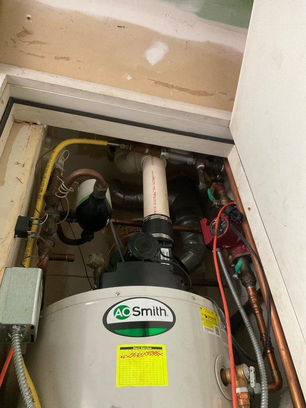 Replaced faulty check valve in Grundfos circulator pump under Blue Frost warranty coverage. Part was staged at headquarters prior to service call, and replacement was completed successfully in utility closet adjacent to AO Smith water heater installation.