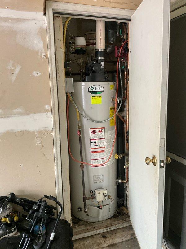 Replaced faulty check valve in Grundfos circulator pump under Blue Frost warranty coverage. Part was staged at headquarters prior to service call, and replacement was completed successfully in utility closet adjacent to AO Smith water heater installation.