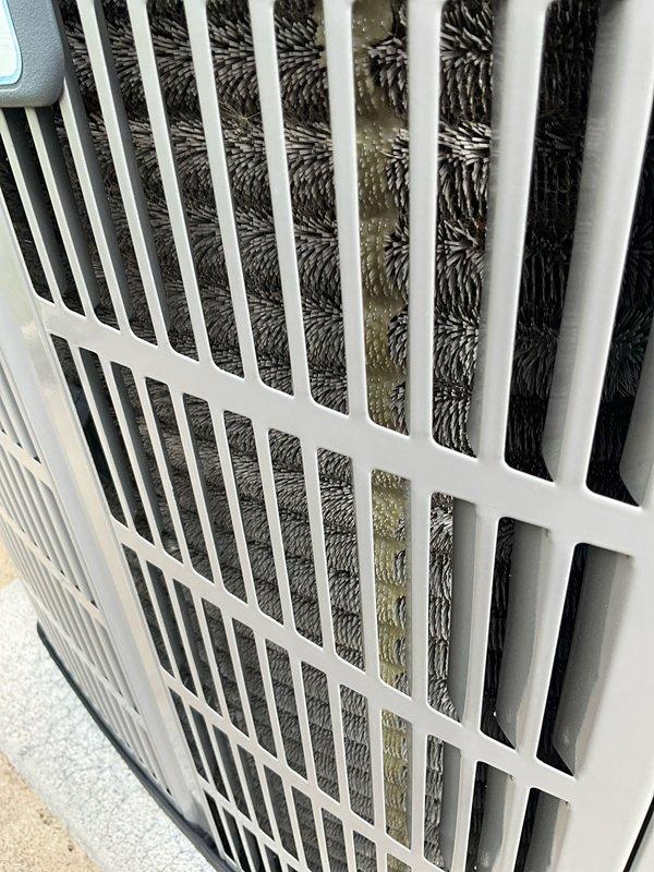 Completed comprehensive air conditioning tune-up on 7+ year old system during morning service window. Performed standard maintenance procedures including inspection of evaporator coil, which showed dust accumulation and vertical staining on return air grille requiring cleaning. Documented significant condensation on supply ductwork indicating proper cooling operation but potential insulation concerns in attic space where air handler is located. Inspected air filter condition and overall system components, verified proper airflow through return grille, and assessed ductwork integrity near foam insulation panels in mechanical area.