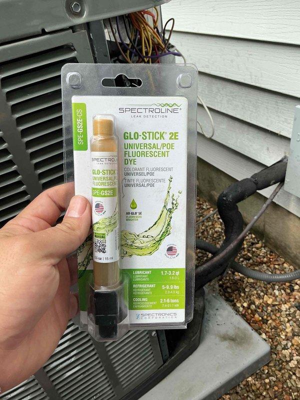 Completed comprehensive AC tune-up on residential condenser unit. Performed system inspection, added UV fluorescent dye to refrigerant circuit for leak detection monitoring, and assessed coil condition which showed heavy accumulation of dirt and debris on exterior surfaces. Unit operational at time of service completion with all safety checks performed according to maintenance protocol.