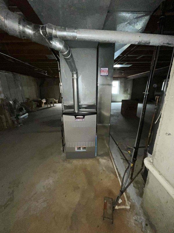 Completed comprehensive BFMA tune-up on 14+ year old residential HVAC system including both indoor furnace unit located in basement utility area and outdoor condensing unit positioned on concrete pad with river rock landscaping. Performed standard maintenance protocol including inspection of ductwork connections, heat exchanger coils, electrical components, and refrigerant lines on both units. All system components were evaluated, cleaned as needed, and confirmed to be operating within normal parameters upon completion of service.