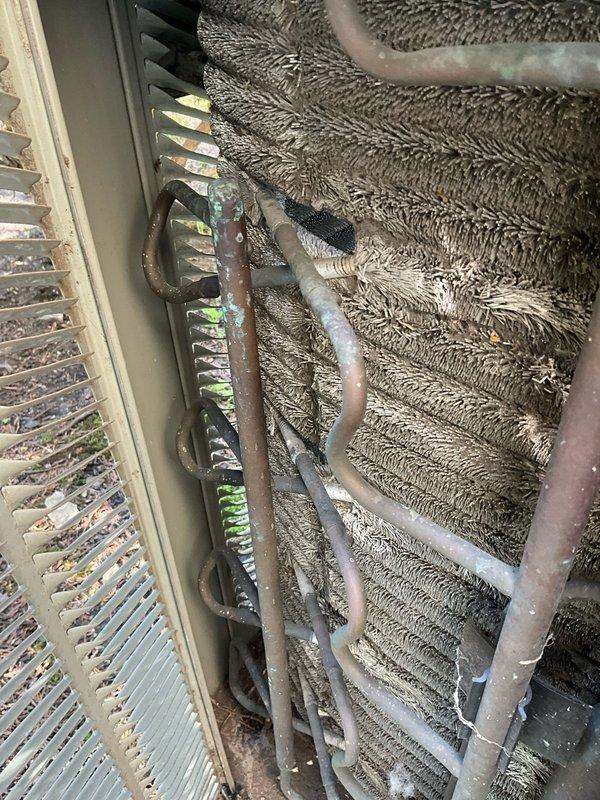 Completed comprehensive air conditioning tune-up maintenance service on residential HVAC system. Performed thorough inspection of outdoor condenser unit and indoor evaporator coil assembly, noting dust and debris accumulation on coil fins. Cleaned evaporator coils, inspected refrigerant lines and insulation for integrity, checked all electrical connections, verified proper airflow, and tested system operation to ensure optimal cooling performance. Addressed all customer questions and concerns throughout the service visit to ensure complete satisfaction and understanding of system condition.