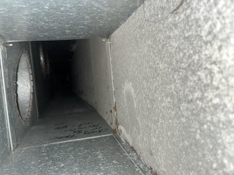 Completed comprehensive duct cleaning service for single-system commercial HVAC installation. Removed substantial dust and debris accumulation from interior ductwork, including heavy buildup on duct walls and support structures. Inspected and replaced dirty pleated air filter showing significant particulate capture and discoloration, restoring proper airflow and system efficiency.