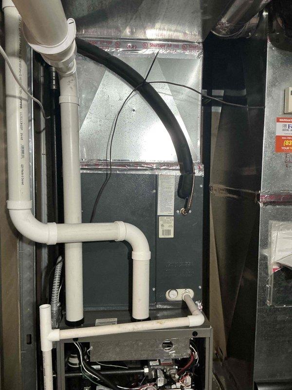 Completed full HVAC system estimate at residential property. Evaluated existing furnace/air handler installation in basement utility area, including ductwork connections, PVC condensate drainage lines, gas connections, and electrical wiring. Assessed electrical service panel and circuit breaker configuration to determine compatibility with proposed system replacement.