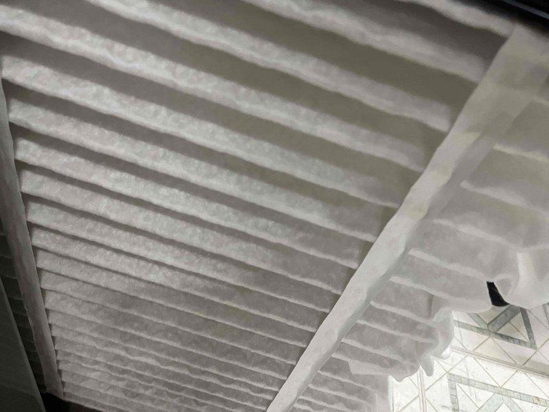 Completed comprehensive BFMA tune-up on 10-month-old AC system during early afternoon service window. Performed standard preventive maintenance inspection including filter evaluation and refrigerant line assessment. Documented significant frost accumulation on refrigerant lines indicating potential airflow restriction or refrigerant charge issue requiring further diagnosis. Air filter showed light dust accumulation consistent with normal usage. Captured photographic documentation of system condition for service records.