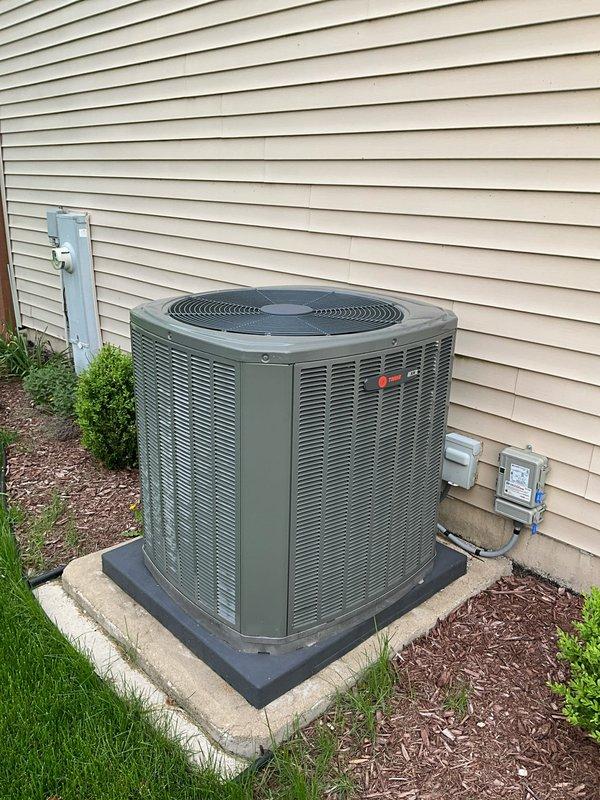 Completed comprehensive BFMA preventive maintenance tune-up on residential air conditioning system. Performed full system inspection of outdoor condenser unit, verified proper operation of compressor and condenser fan motor, checked refrigerant levels and electrical connections, cleaned condenser coils, and confirmed unit is operating within manufacturer specifications. System tested and running efficiently with adequate airflow and proper clearances maintained around equipment.
