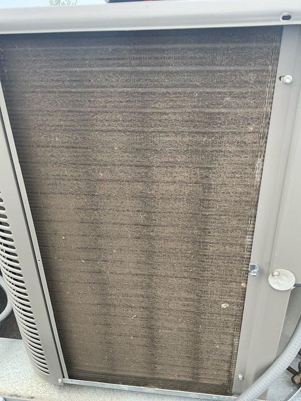 Completed comprehensive BFMA tune-up service on residential air conditioning system with equipment age of 1+ years. Upon inspection, discovered heavily soiled evaporator coil and air filter with significant accumulation of dust, dirt, and debris restricting airflow and reducing system efficiency. Cleaned evaporator coil fins, replaced clogged air filter, performed standard maintenance checks including refrigerant levels, electrical connections, condensate drain verification, and operational testing to restore unit to proper working condition.