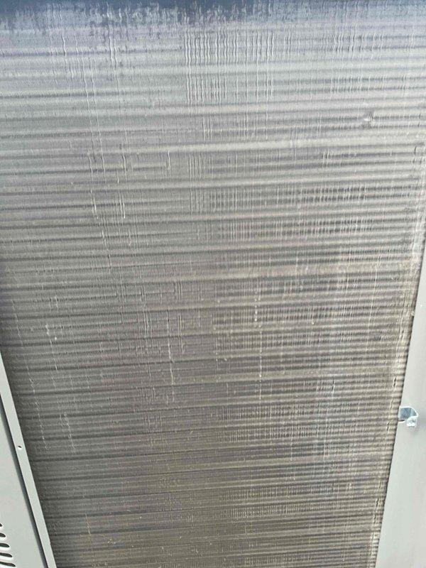 Completed comprehensive BFMA tune-up service on residential air conditioning system with equipment age of 1+ years. Upon inspection, discovered heavily soiled evaporator coil and air filter with significant accumulation of dust, dirt, and debris restricting airflow and reducing system efficiency. Cleaned evaporator coil fins, replaced clogged air filter, performed standard maintenance checks including refrigerant levels, electrical connections, condensate drain verification, and operational testing to restore unit to proper working condition.