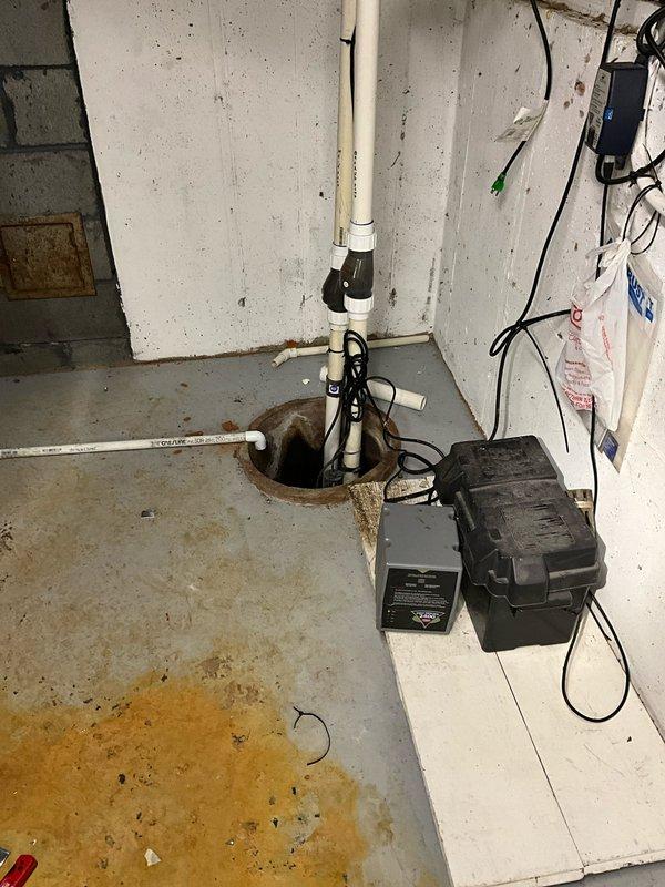 Replaced primary sump pump in residential basement sump pit while maintaining existing battery backup system. Installed new submersible pump with PVC discharge piping, check valve, and proper electrical connections to ensure reliable water removal and basement flood protection.