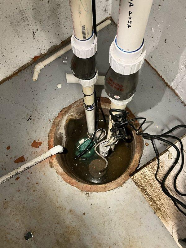 Replaced primary sump pump in residential basement sump pit while maintaining existing battery backup system. Installed new submersible pump with PVC discharge piping, check valve, and proper electrical connections to ensure reliable water removal and basement flood protection.