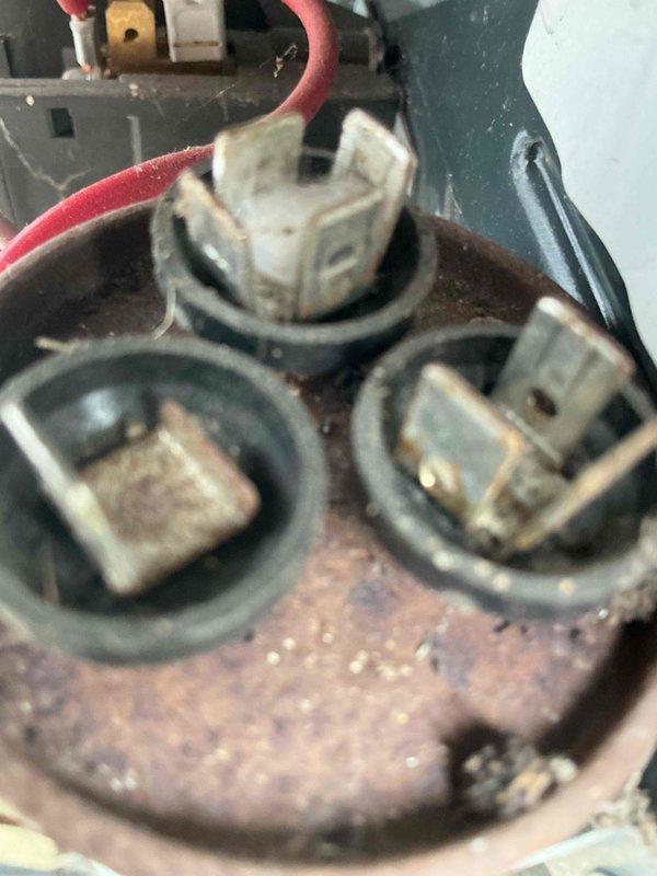 Completed comprehensive air conditioning tune-up on residential unit over 5 years old during afternoon service window. Performed standard maintenance protocol including inspection of electrical connections, which revealed significant rust and corrosion on terminal block housing requiring documentation. Inspected condensate drain system and frame assembly, noting accumulated debris and age-related wear on tracks and channels that were cleaned during service.