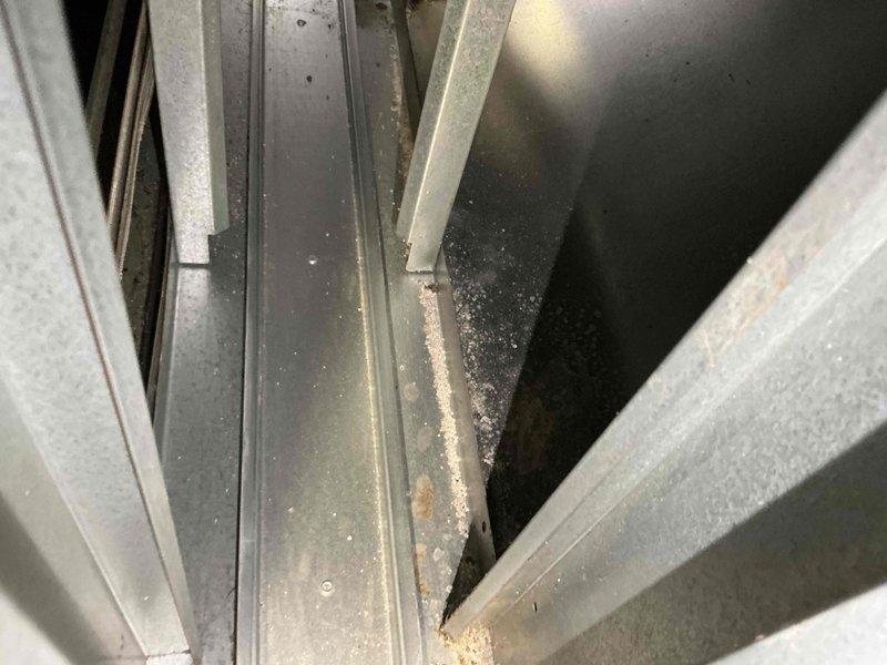 Completed comprehensive air conditioning tune-up on residential unit over 5 years old during afternoon service window. Performed standard maintenance protocol including inspection of electrical connections, which revealed significant rust and corrosion on terminal block housing requiring documentation. Inspected condensate drain system and frame assembly, noting accumulated debris and age-related wear on tracks and channels that were cleaned during service.